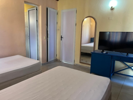 CONDOMINIUM ON THE BEACH (9 rooms with private bathrooms)